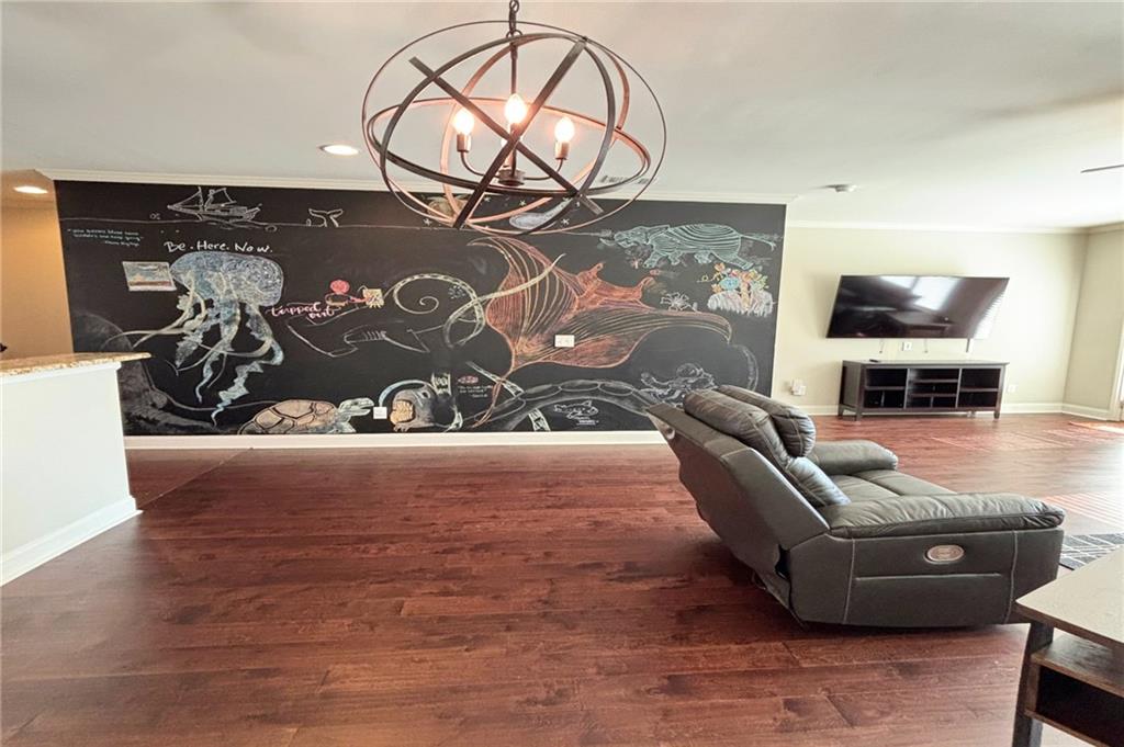 772 Liberty Commons Drive Northwest Atlanta, GA 30314 - Photo 7 of 23 a living room with furniture and a flat screen tv
