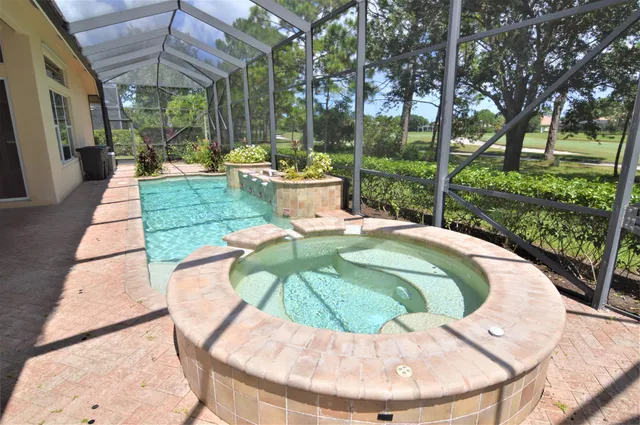 a view of a swimming pool with a patio
