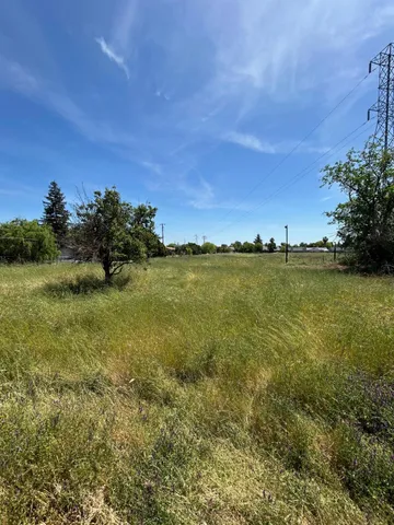 a view of a ocean with a building in the background