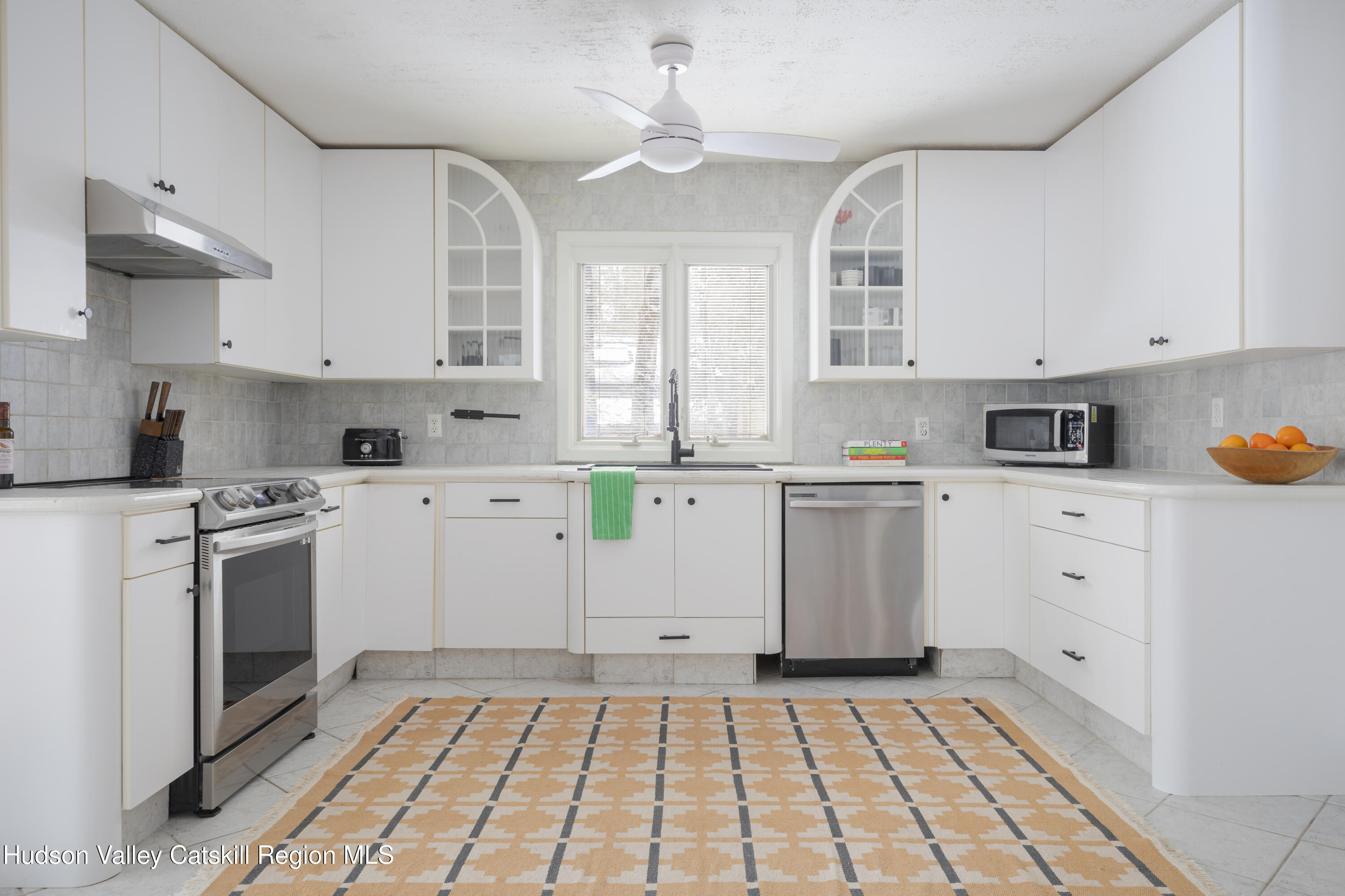26 Krom Road Olivebridge, NY 12461 - Photo 13 of 24 a kitchen with a stove a sink and a refrigerator