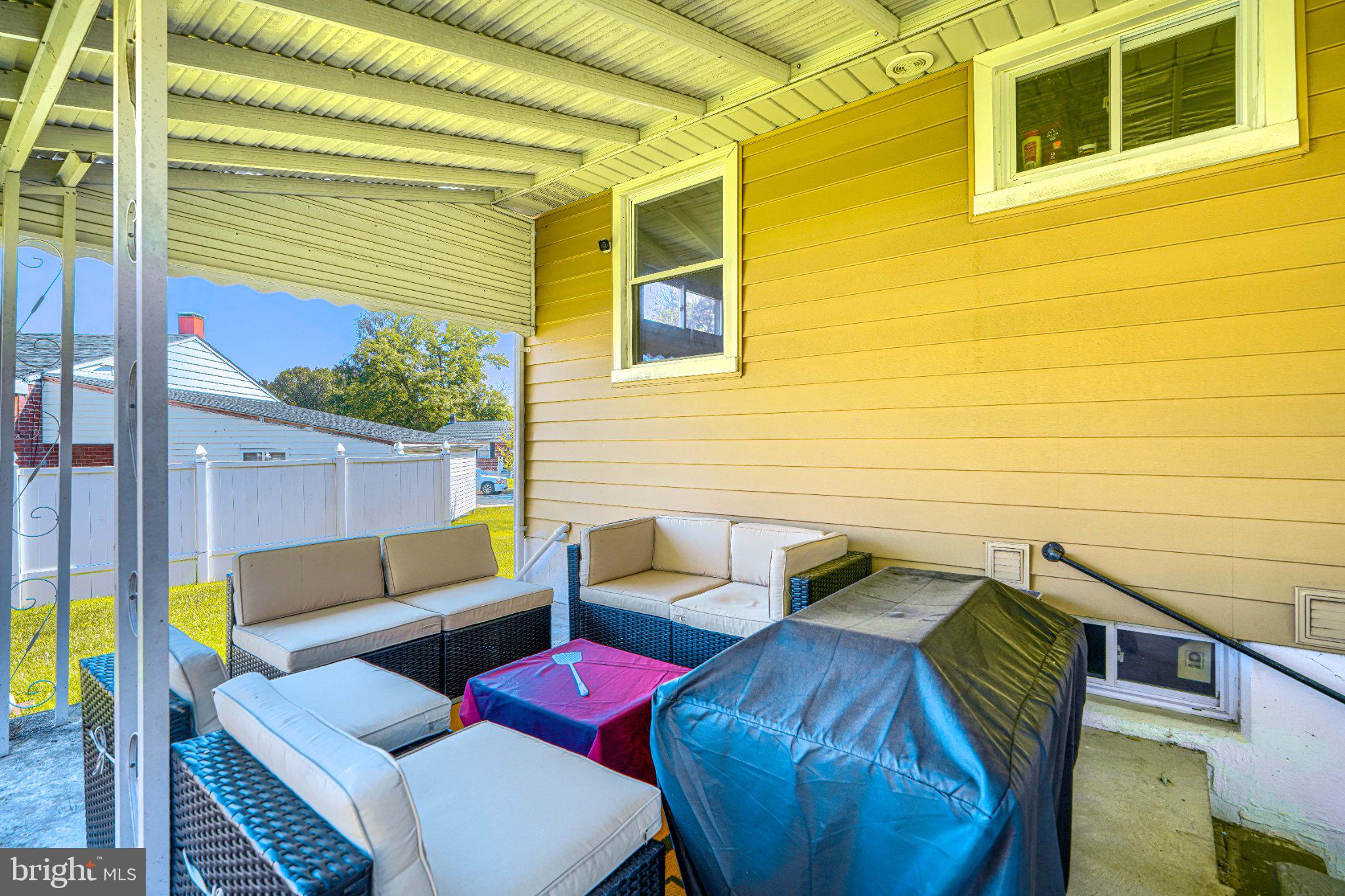 3708 Cassen Road Randallstown, MD 21133 - Photo 36 of 38 a view of a deck with couches chairs with wooden floor