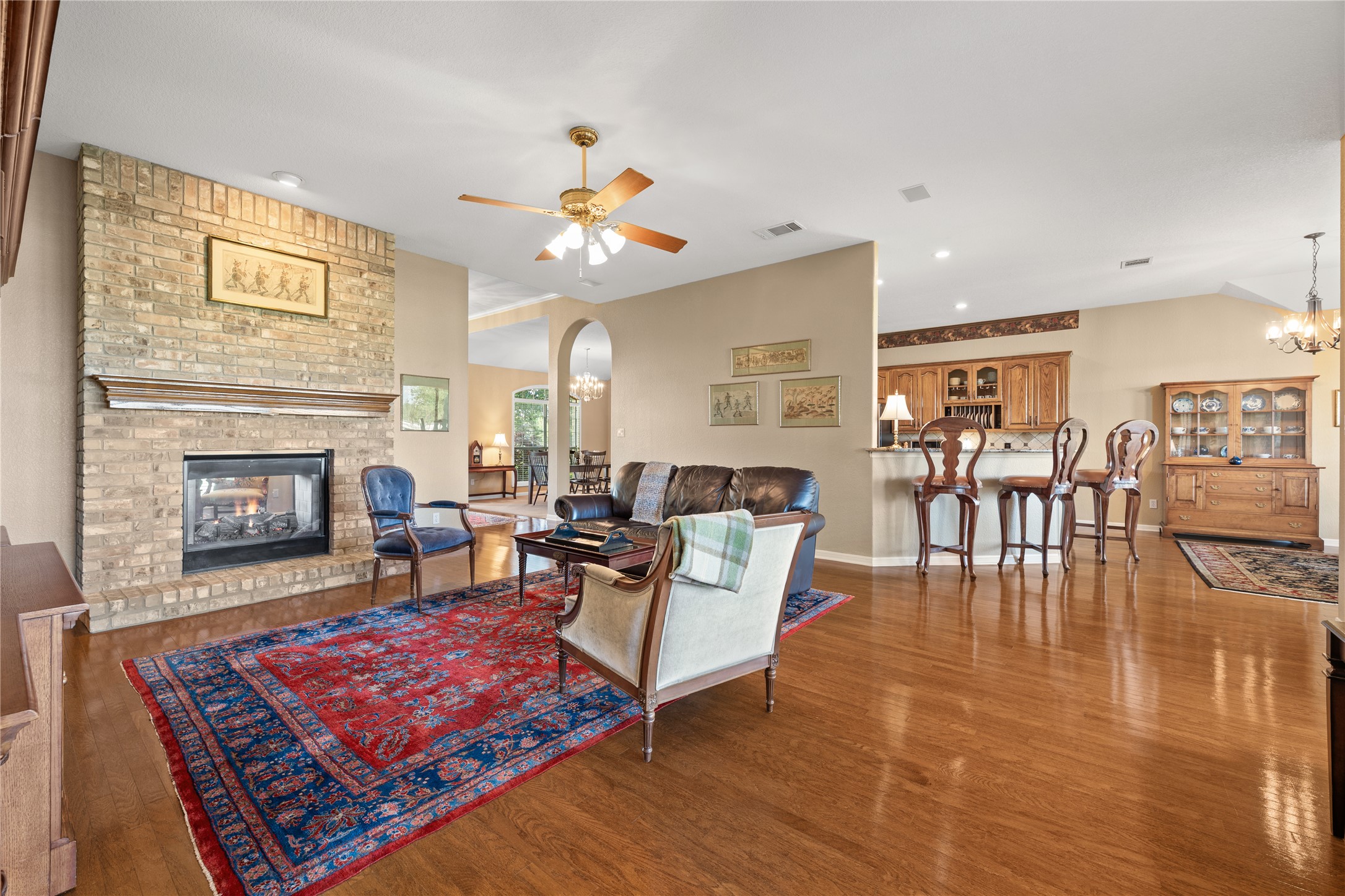 266 Courtnee's Way Georgetown, TX 78626 - Photo 11 of 40 Brick to the ceiling, Double Sided, Gas Log Fireplace and rich wood flooring!