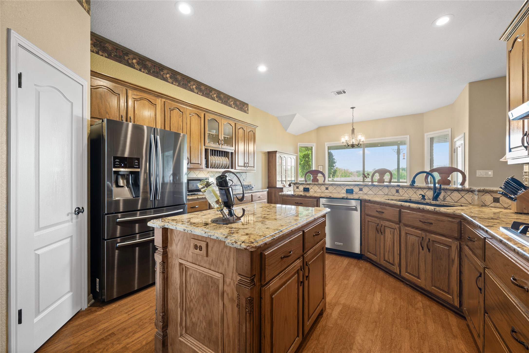 266 Courtnee's Way Georgetown, TX 78626 - Photo 13 of 40 Walk-in Pantry, center island with a granite countertop, custom cabinets and Stainless appliances.