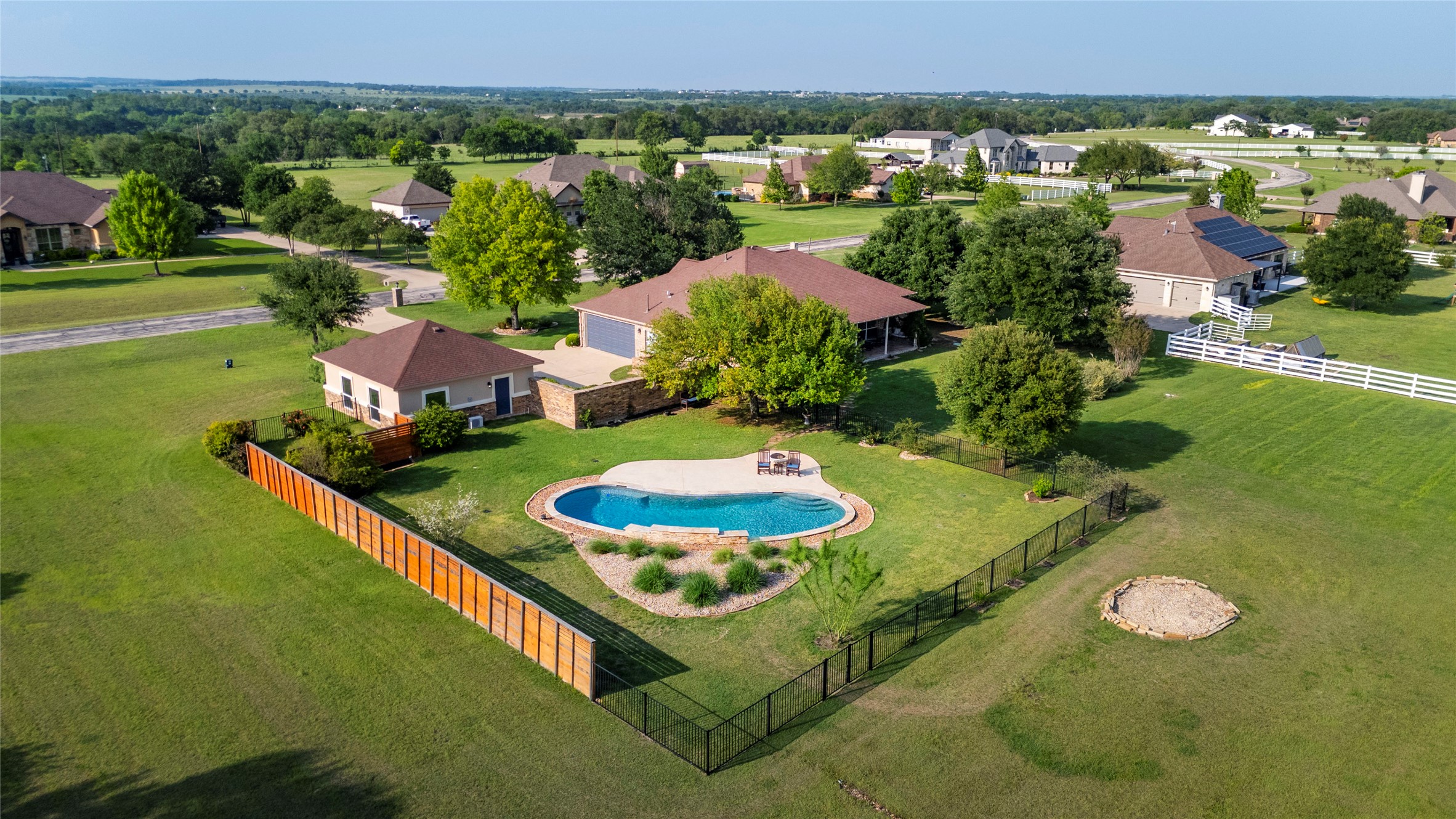 266 Courtnee's Way Georgetown, TX 78626 - Photo 28 of 40 2 Acre Property with Detached Garage, Swimming Pool, Wrought Iron and Privacy Fencing around the pool area.
