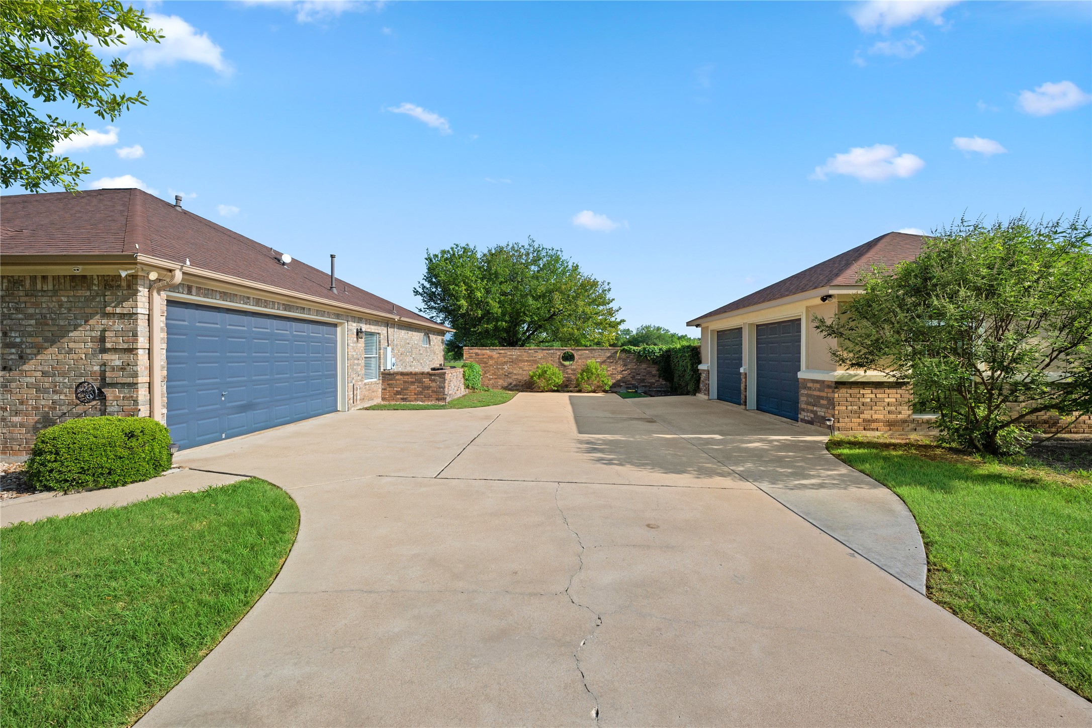 266 Courtnee's Way Georgetown, TX 78626 - Photo 3 of 40 2 Car attached Garage, Oversized 2 Car Detached Brick/Stucco Garage with Brick privacy wall