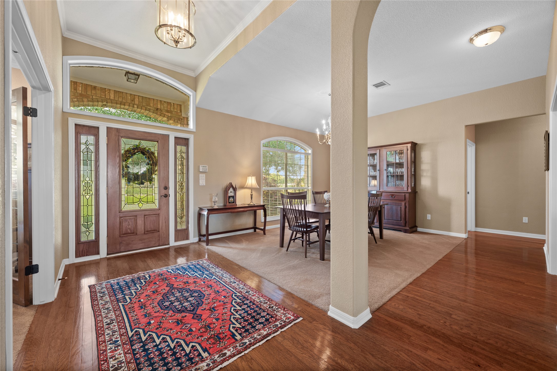 266 Courtnee's Way Georgetown, TX 78626 - Photo 5 of 40 A bright, airy foyer designed with wood flooring that creates a welcoming atmosphere