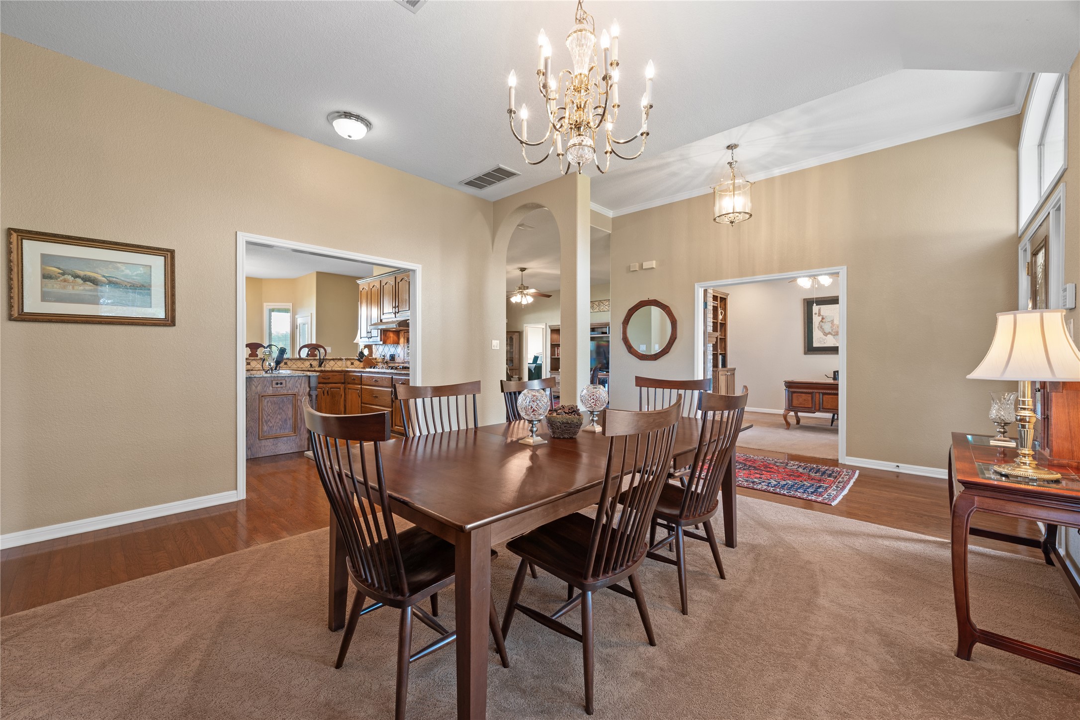 266 Courtnee's Way Georgetown, TX 78626 - Photo 6 of 40 Expansive dining room with wood flooring, high ceilings and view into the kitchen.
