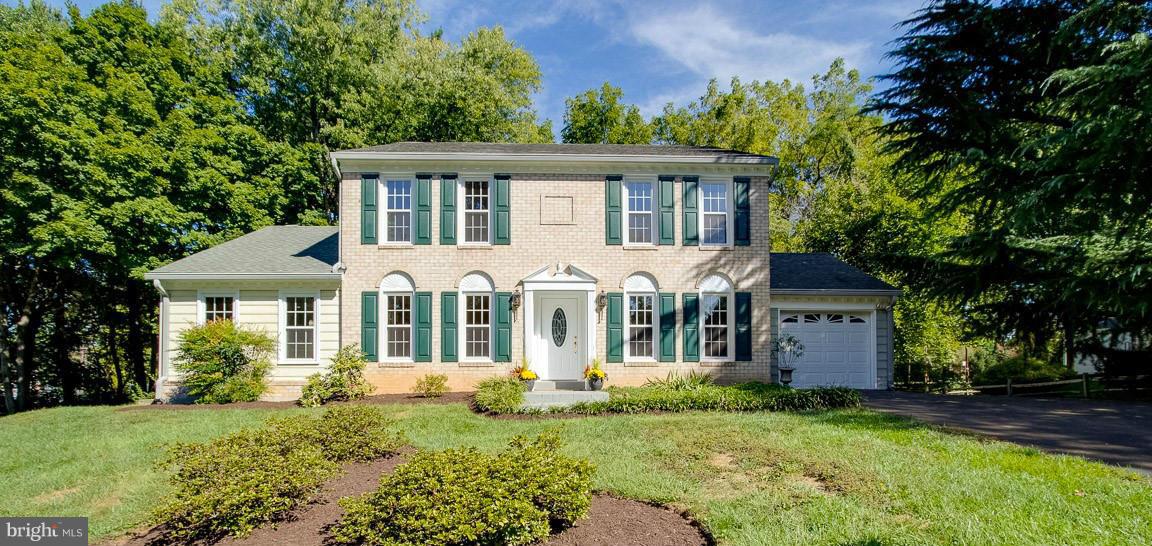 10802 Hunt Club Road Reston, VA 20190 - Photo 2 of 30 front view of a house with a yard