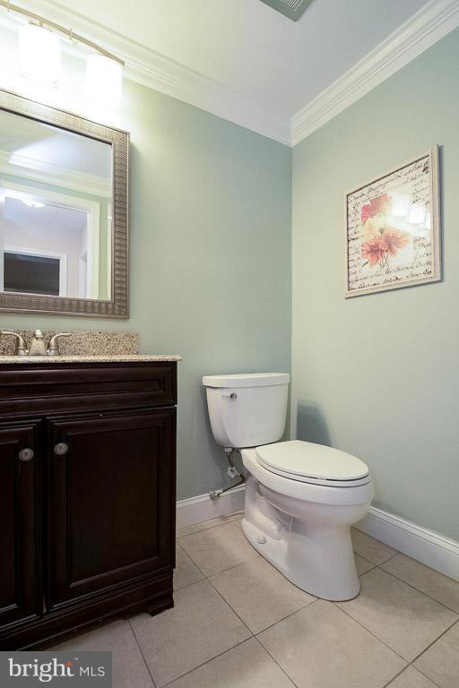 10802 Hunt Club Road Reston, VA 20190 - Photo 12 of 30 a bathroom with a toilet a sink and mirror