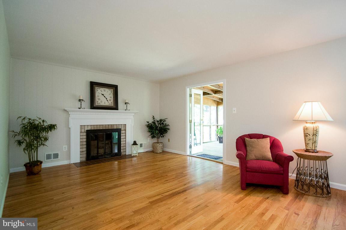 10802 Hunt Club Road Reston, VA 20190 - Photo 13 of 30 a bedroom with furniture and a fireplace
