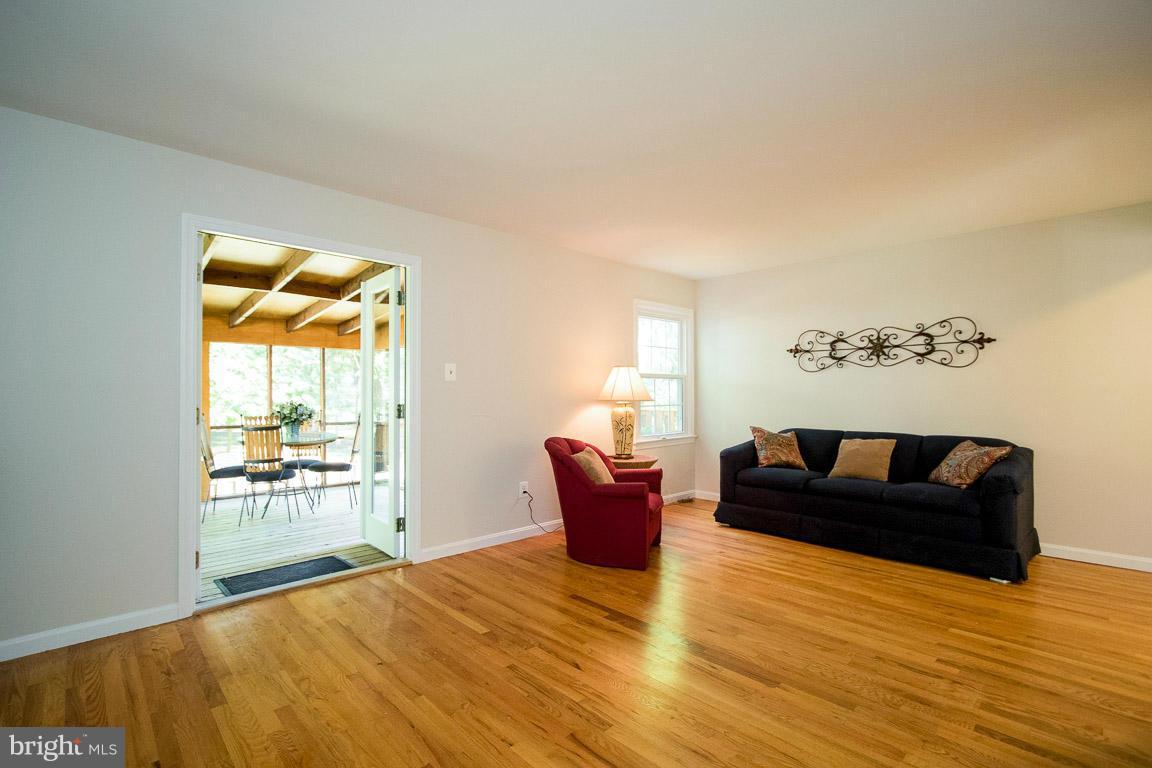 10802 Hunt Club Road Reston, VA 20190 - Photo 14 of 30 a living room with furniture and a large window