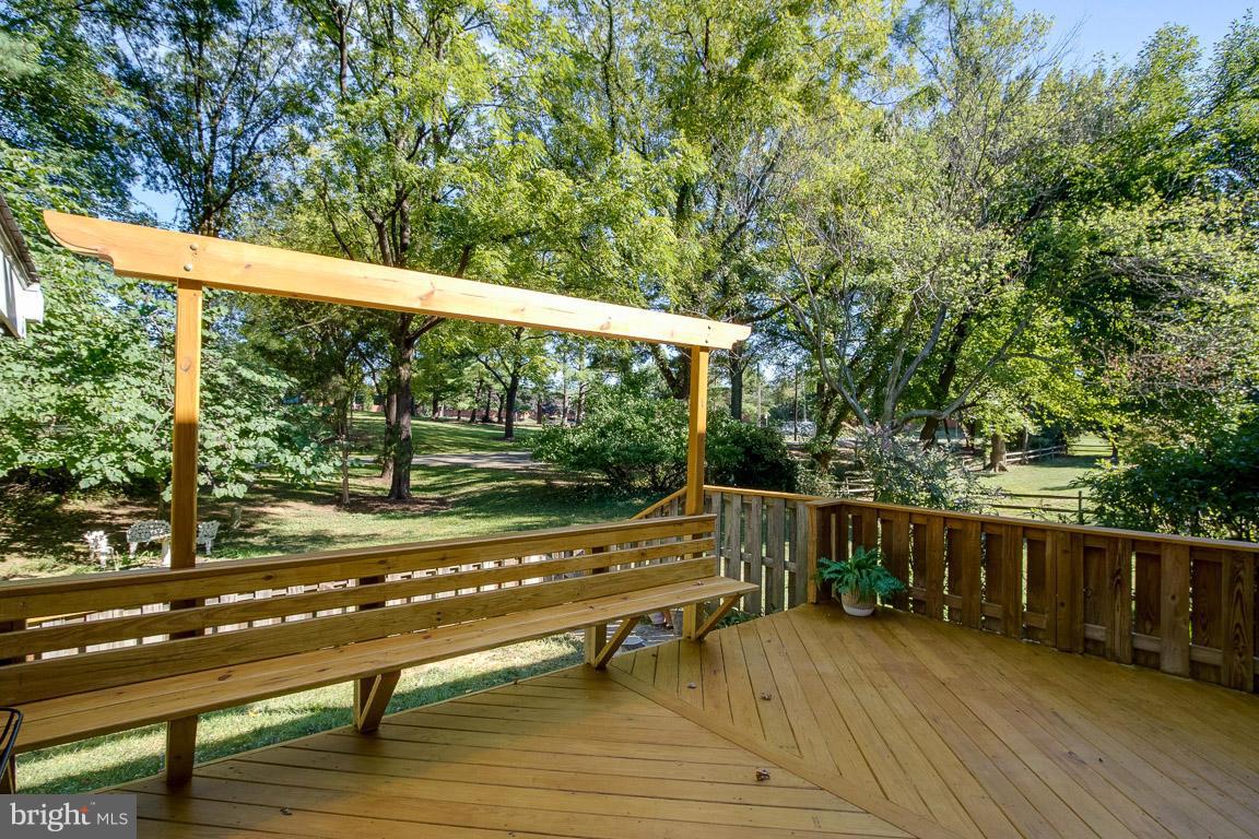 10802 Hunt Club Road Reston, VA 20190 - Photo 17 of 30 a view of sitting area with furniture and wooden deck