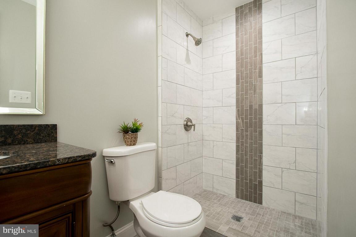 10802 Hunt Club Road Reston, VA 20190 - Photo 21 of 30 a white toilet sitting next to a bathroom sink