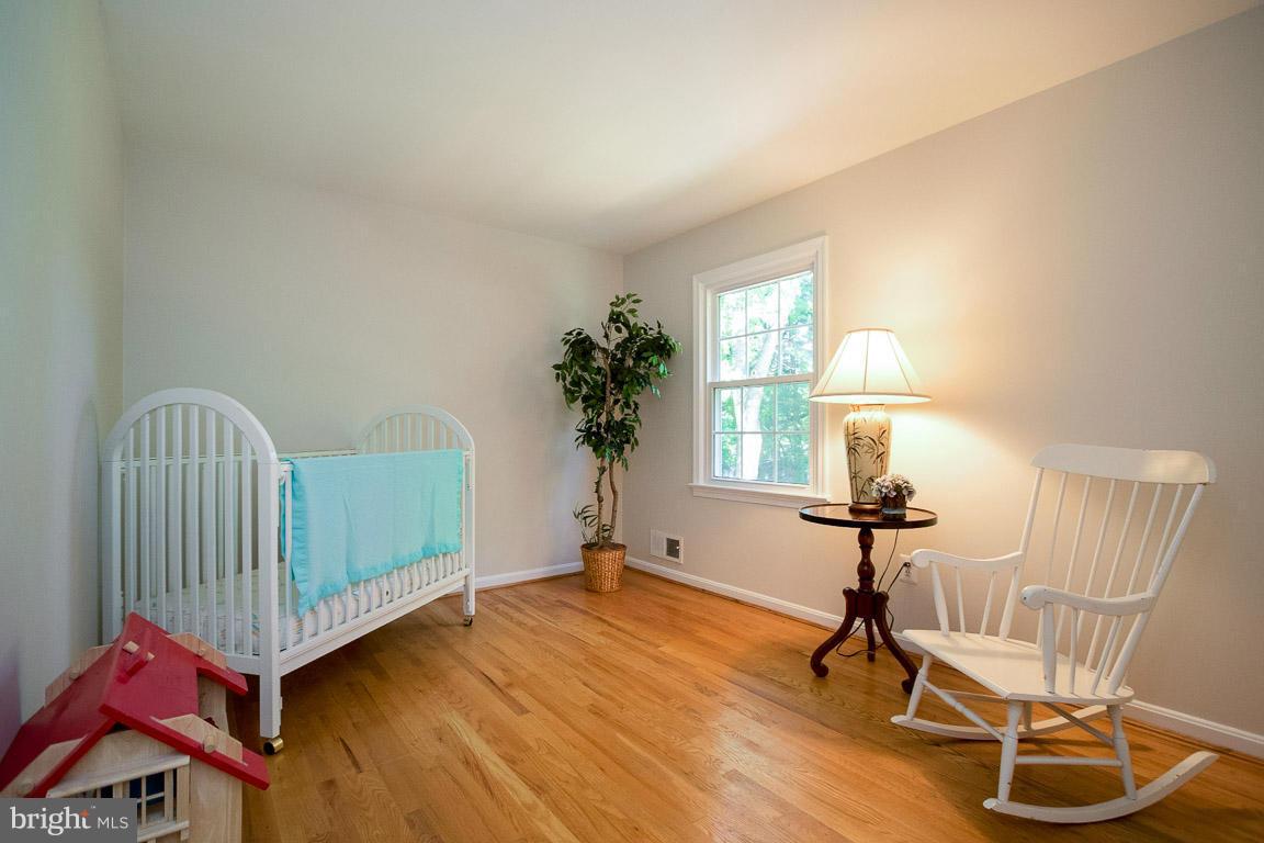 10802 Hunt Club Road Reston, VA 20190 - Photo 23 of 30 a view of a room with wooden floor windows and wooden floor
