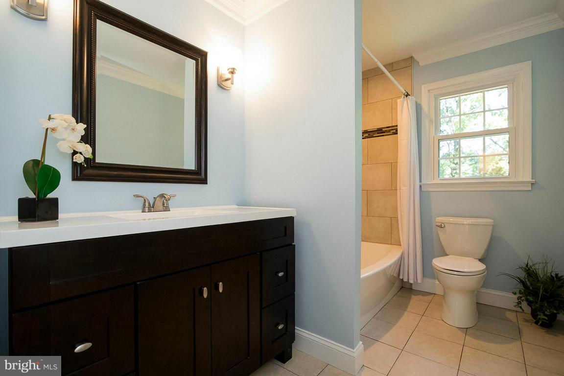 10802 Hunt Club Road Reston, VA 20190 - Photo 24 of 30 a bathroom with a toilet sink and mirror