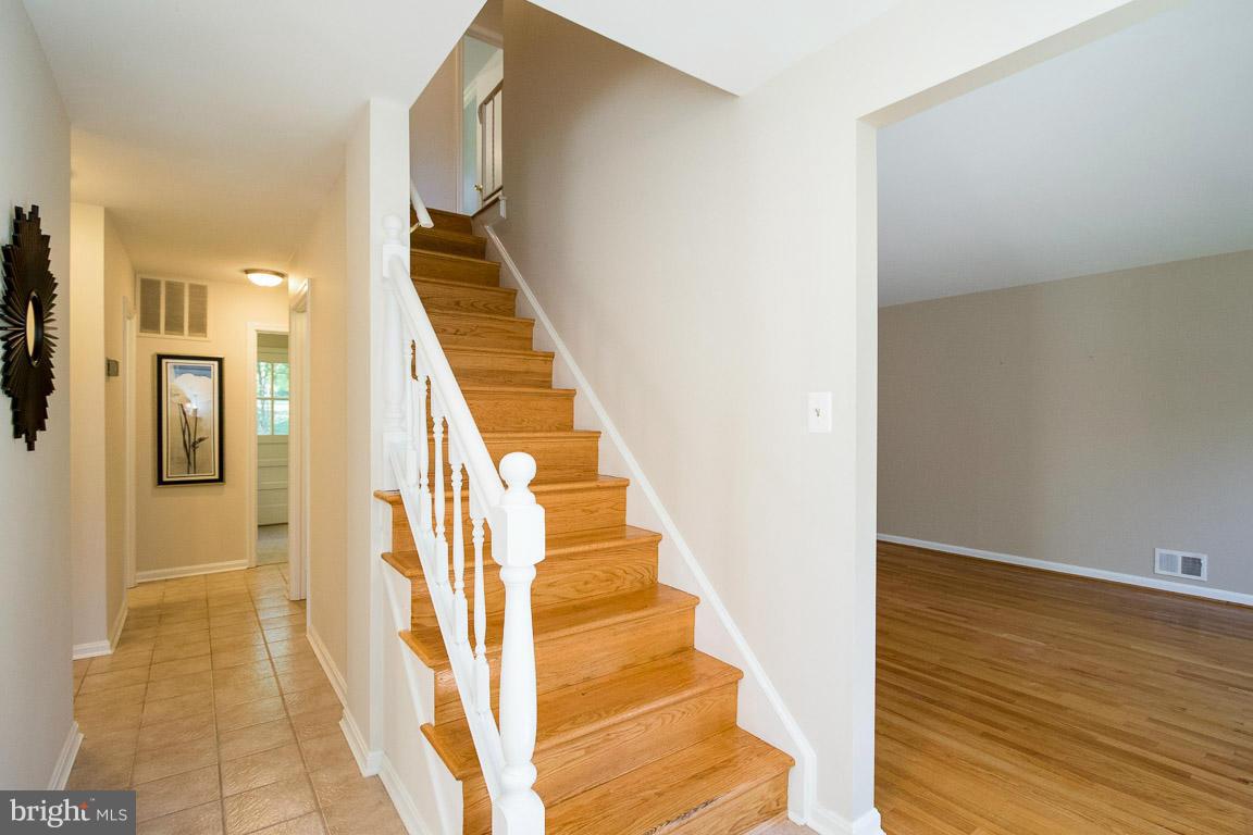 10802 Hunt Club Road Reston, VA 20190 - Photo 4 of 30 a view of an entryway with wooden floor