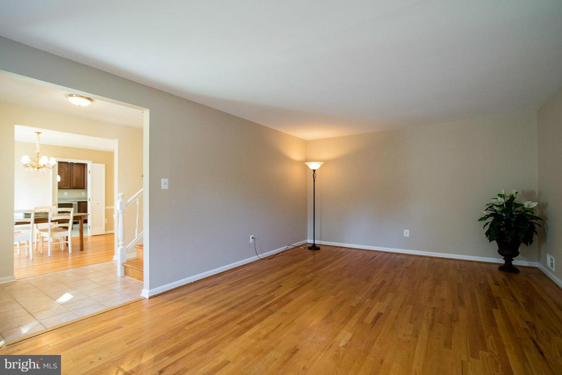 10802 Hunt Club Road Reston, VA 20190 - Photo 5 of 30 a view of empty room with wooden floor