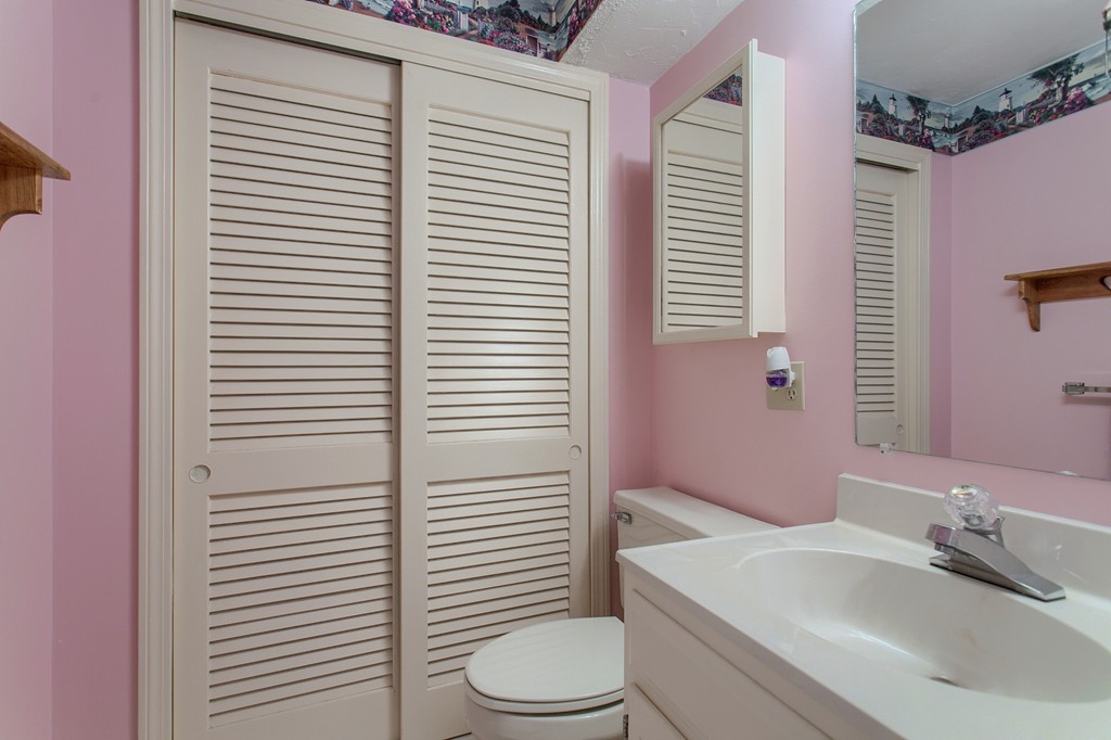 914 Ridgefield Circle, Unit B Clinton, MA 01510 - Photo 13 of 30 a bathroom with a sink a toilet and tub