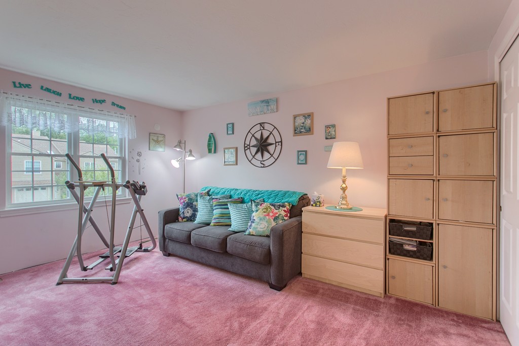 914 Ridgefield Circle, Unit B Clinton, MA 01510 - Photo 15 of 30 a living room with furniture and a table