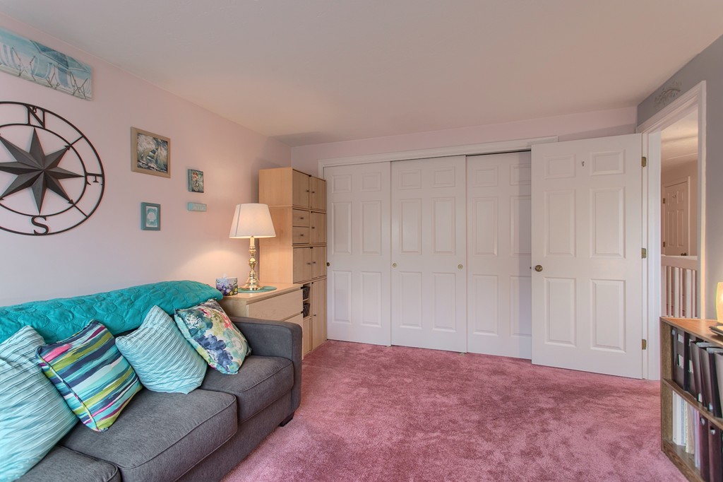 914 Ridgefield Circle, Unit B Clinton, MA 01510 - Photo 17 of 30 a bedroom with a bed and couch