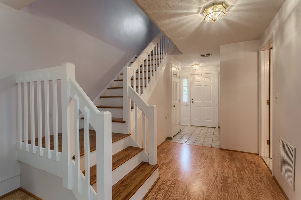 914 Ridgefield Circle, Unit B Clinton, MA 01510 - Photo 2 of 30 a view of staircase with white walls and wooden floor