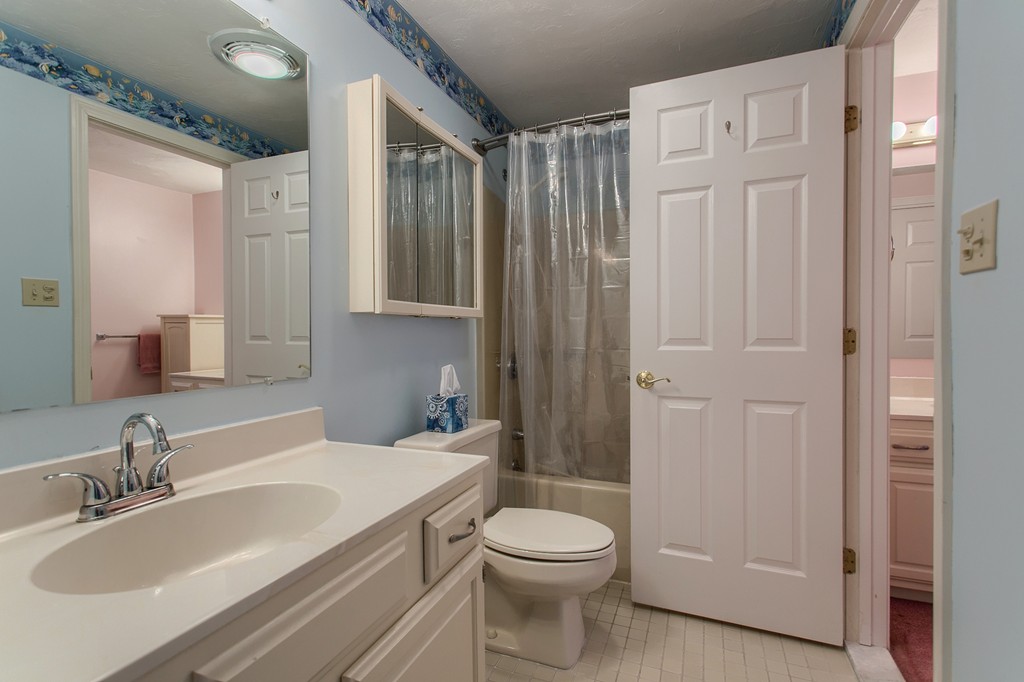 914 Ridgefield Circle, Unit B Clinton, MA 01510 - Photo 22 of 30 a bathroom with a sink a toilet and shower
