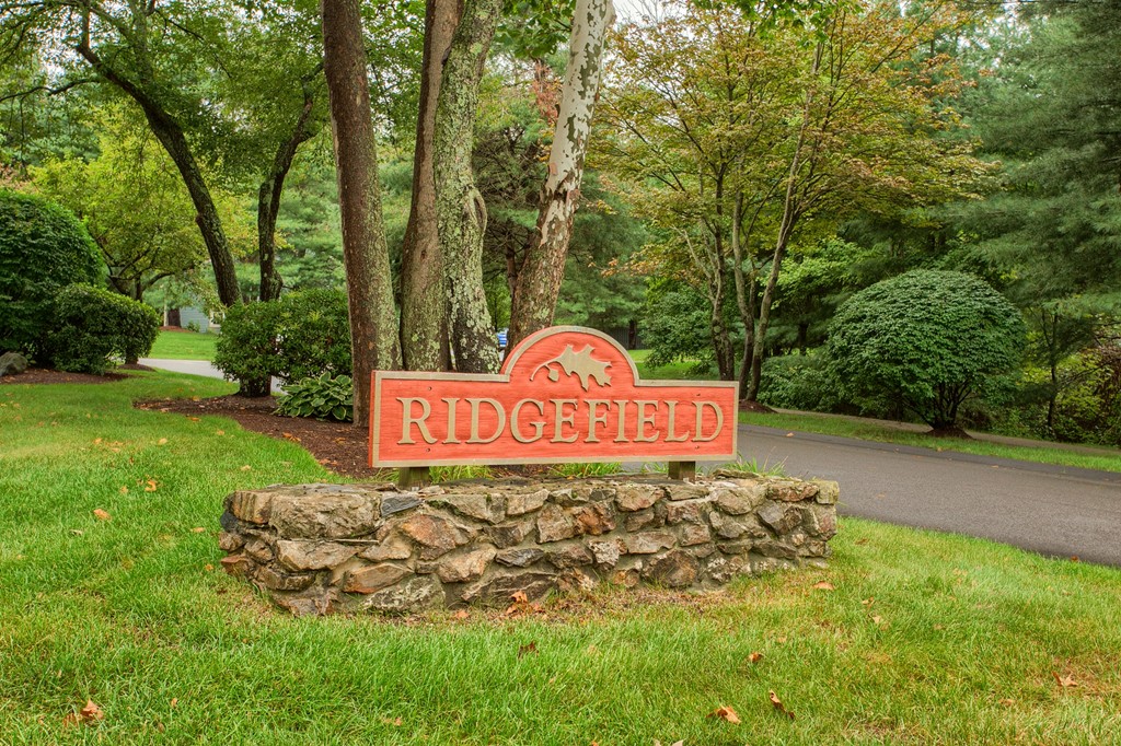 914 Ridgefield Circle, Unit B Clinton, MA 01510 - Photo 30 of 30 a sign that is sitting in the grass