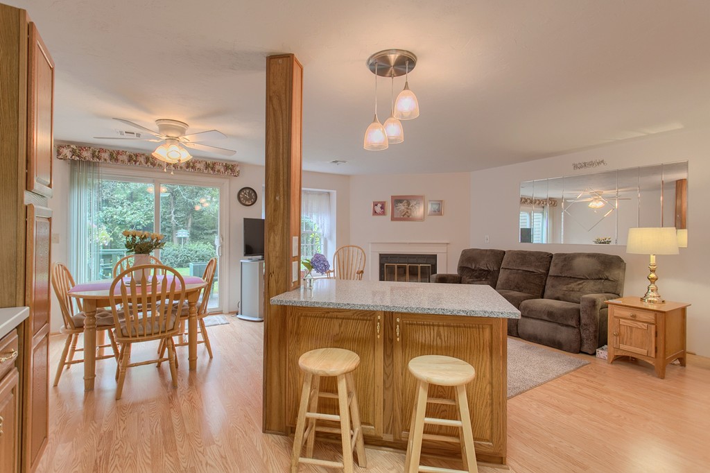 914 Ridgefield Circle, Unit B Clinton, MA 01510 - Photo 7 of 30 a view of a dining room with furniture and wooden floor