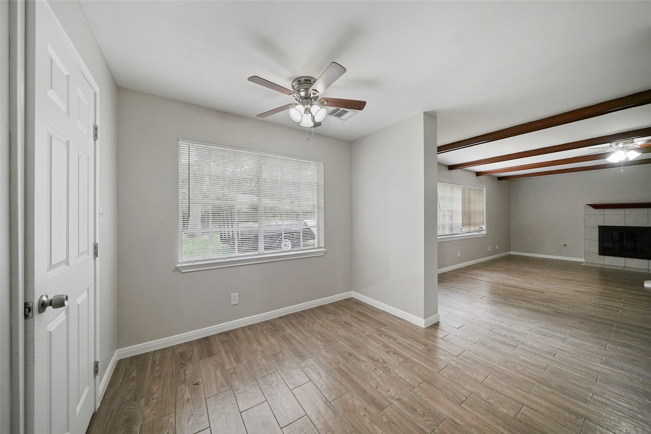 643 Ames Street Spring, TX 77373 - Photo 13 of 32 a view of empty room with wooden floor and fan