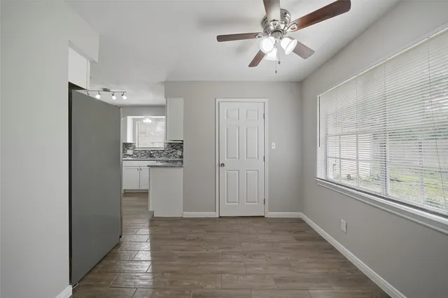 a view of an empty room with a window