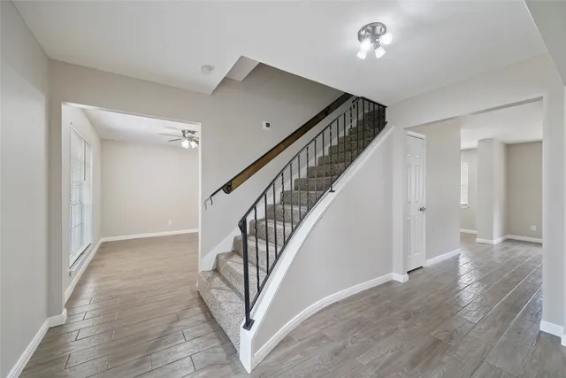 a view of an entryway with wooden floor