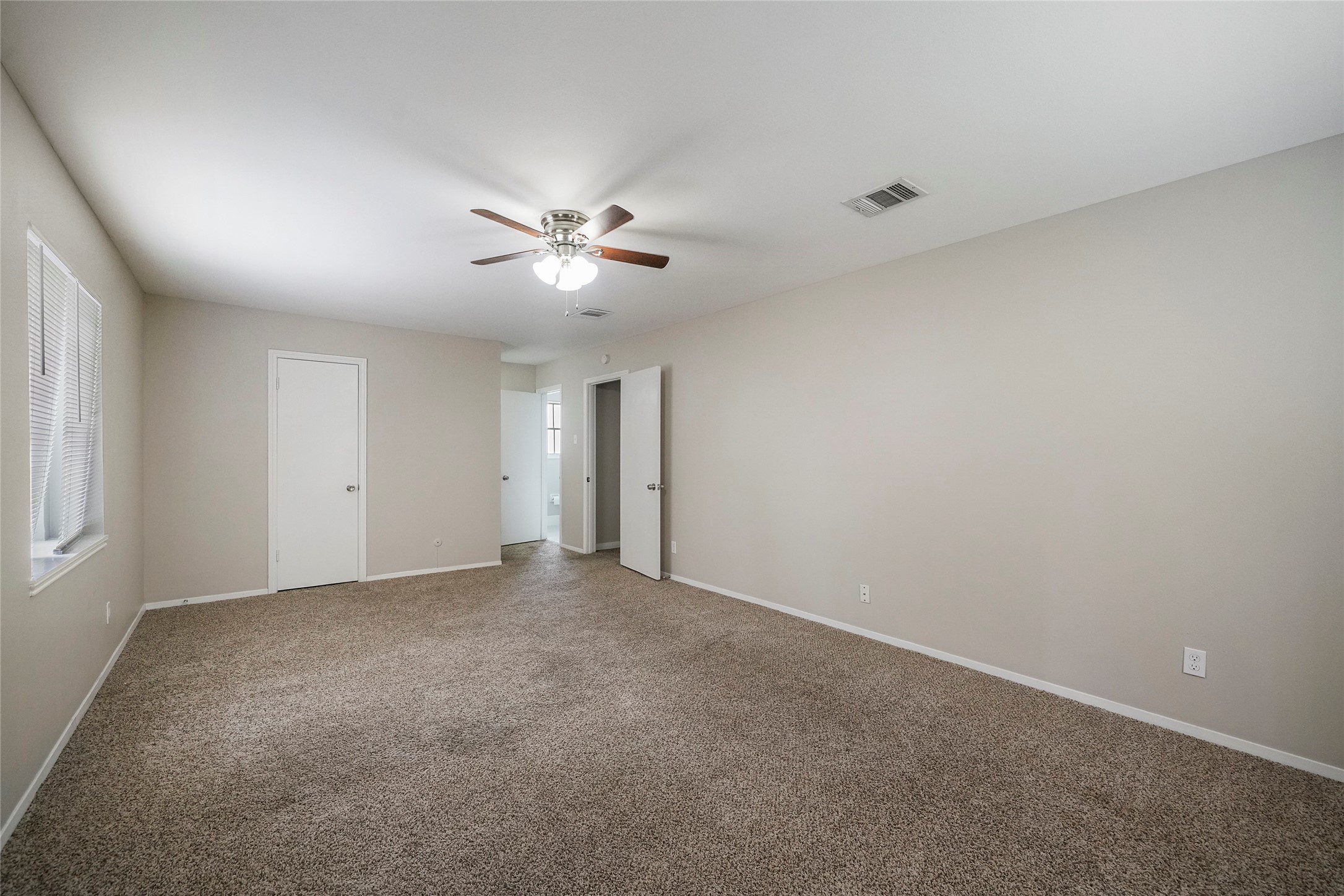 643 Ames Street Spring, TX 77373 - Photo 22 of 32 an empty room with a empty space and a ceiling fan