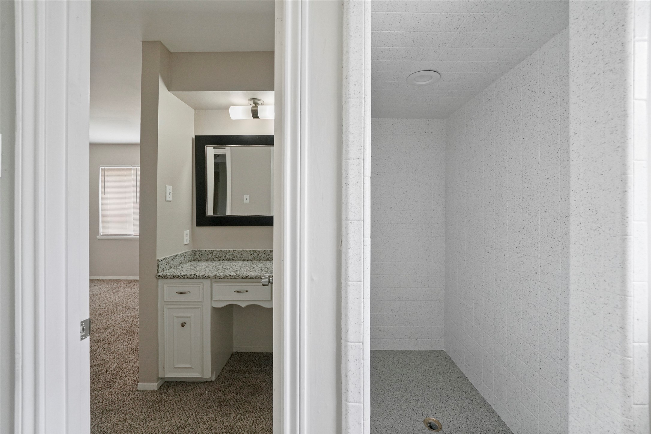 643 Ames Street Spring, TX 77373 - Photo 25 of 32 a bathroom with a sink and a mirror