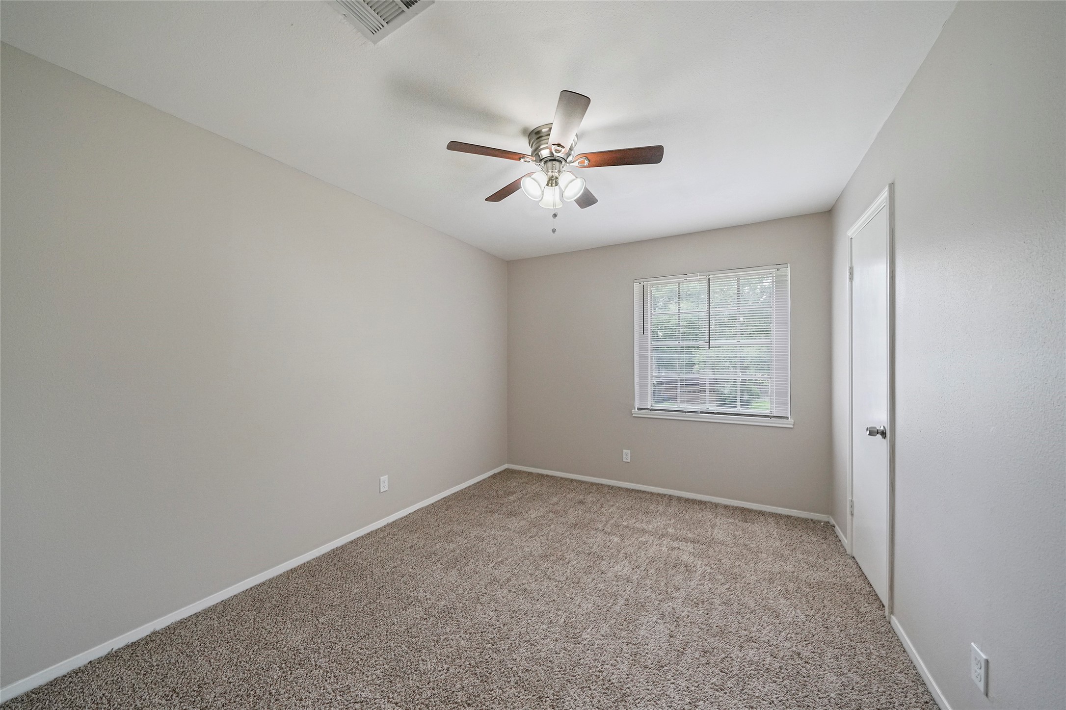 643 Ames Street Spring, TX 77373 - Photo 26 of 32 a view of an empty room with a window