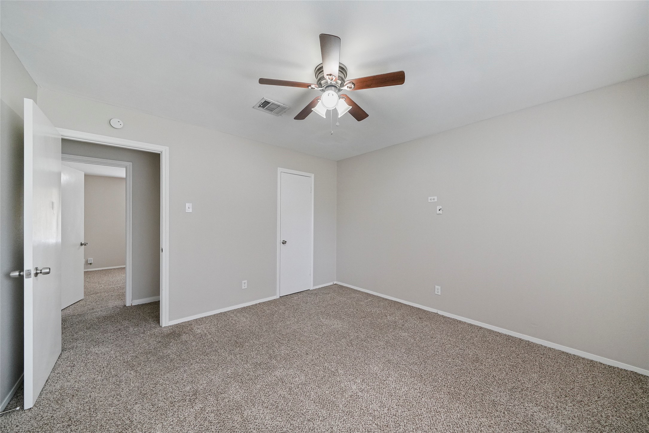 643 Ames Street Spring, TX 77373 - Photo 29 of 32 an empty room with chandelier fan
