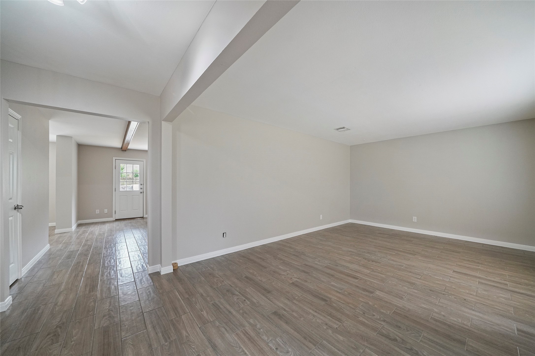 643 Ames Street Spring, TX 77373 - Photo 3 of 32 a view of an empty room and wooden floor