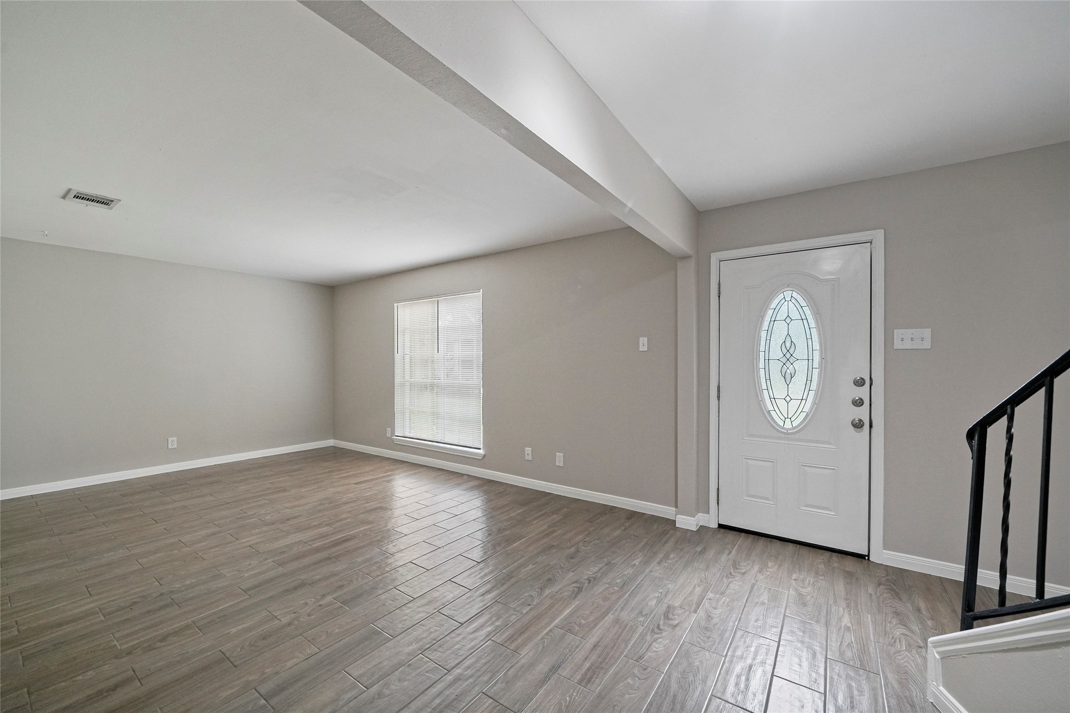 643 Ames Street Spring, TX 77373 - Photo 5 of 32 wooden floor in an empty room with a window