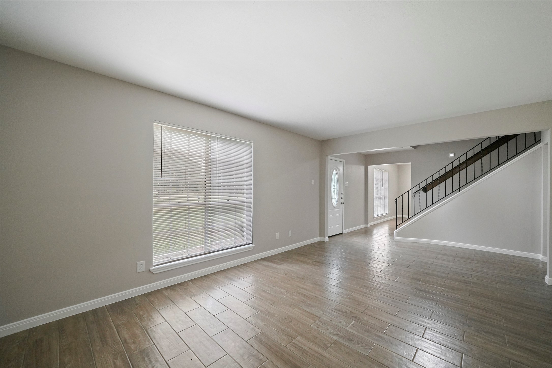 643 Ames Street Spring, TX 77373 - Photo 7 of 32 a view of an empty room with wooden floor and fan
