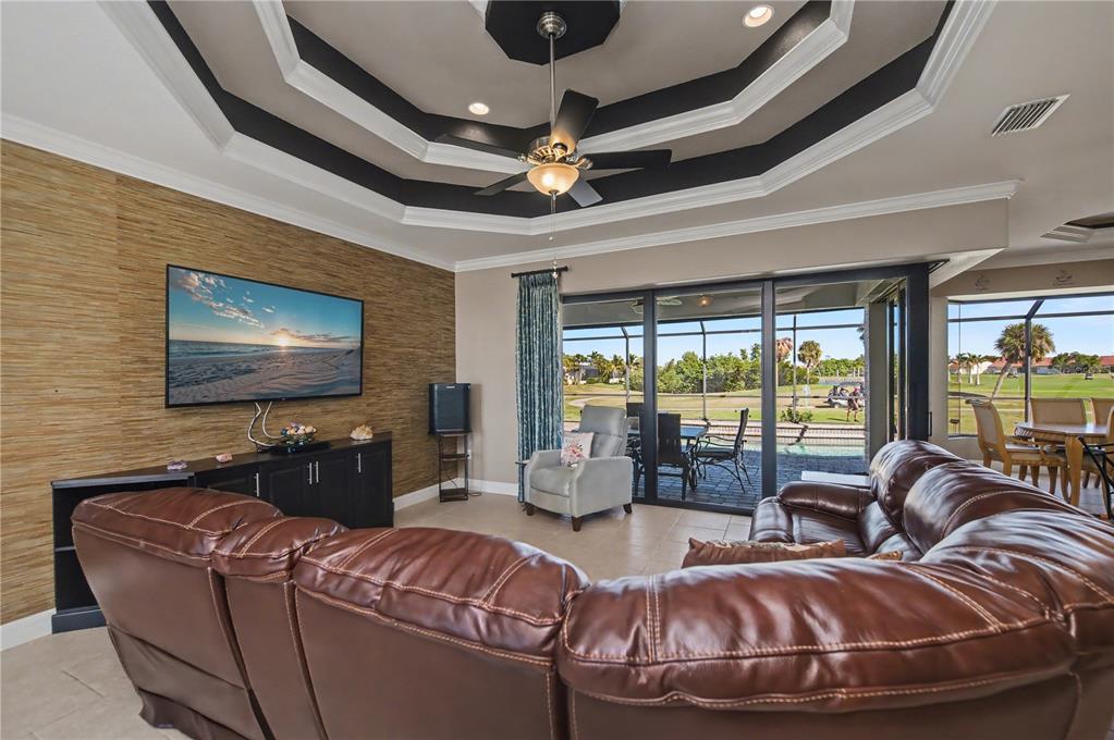 1736 Suzi Street Punta Gorda, FL 33950 - Photo 17 of 80 a living room with furniture and a flat screen tv