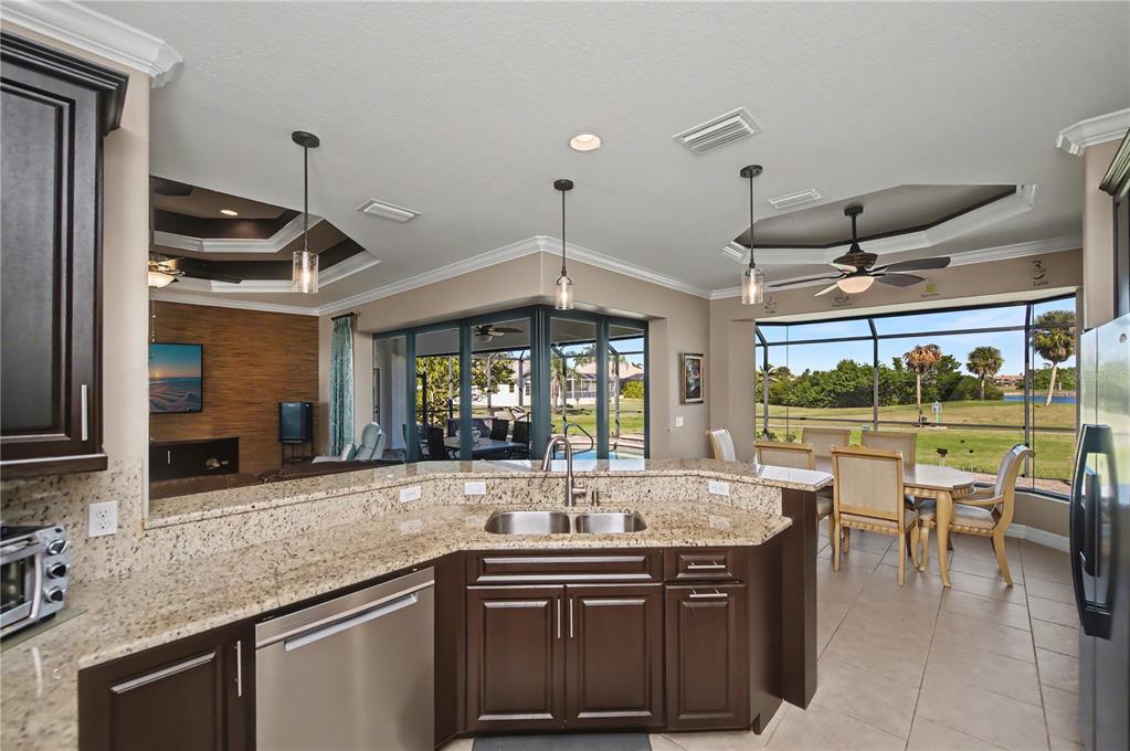 1736 Suzi Street Punta Gorda, FL 33950 - Photo 30 of 80 a kitchen with stainless steel appliances granite countertop a sink and a stove