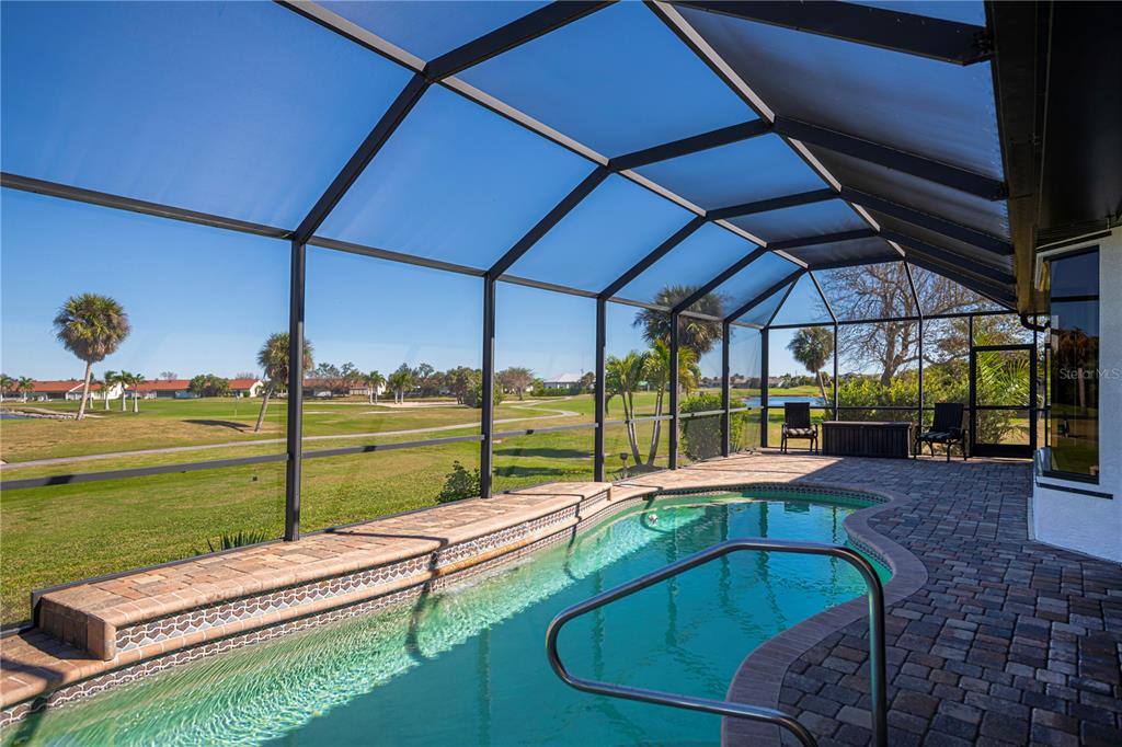 1736 Suzi Street Punta Gorda, FL 33950 - Photo 3 of 80 a view of swimming pool with outdoor seating and a yard