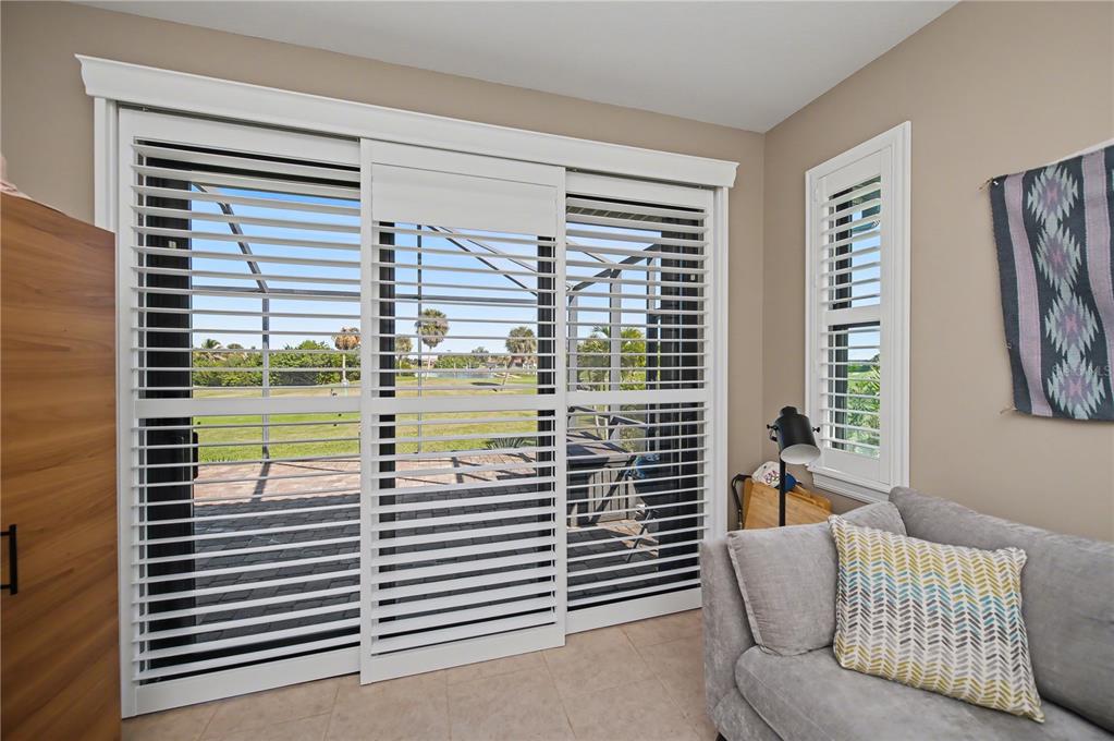 1736 Suzi Street Punta Gorda, FL 33950 - Photo 46 of 80 a view of a bedroom with a large window and a bed