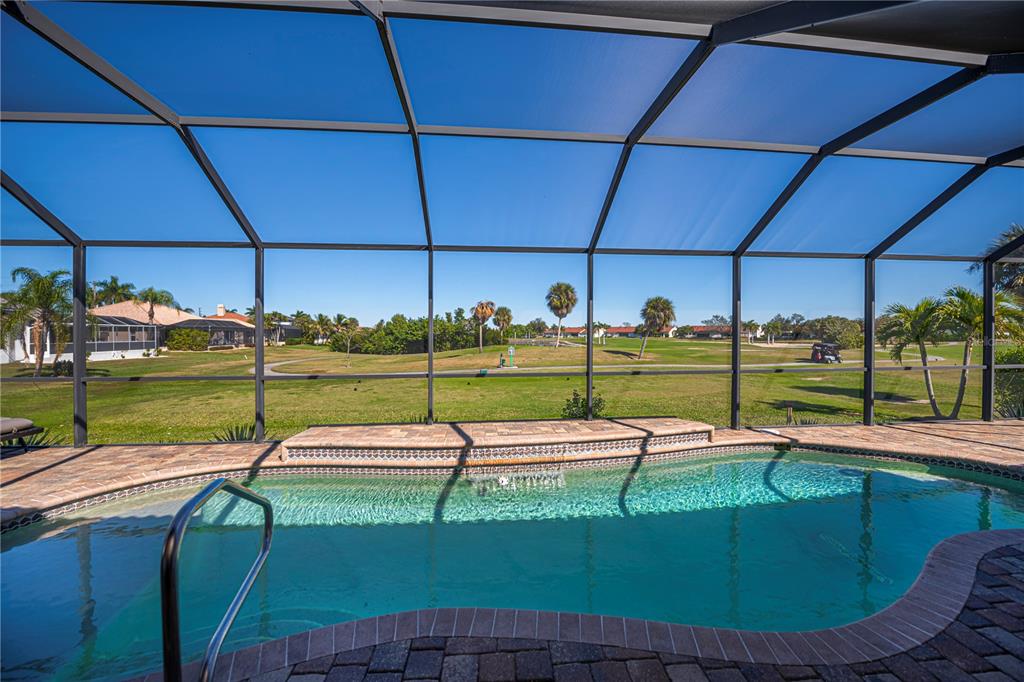 1736 Suzi Street Punta Gorda, FL 33950 - Photo 59 of 80 a view of a swimming pool with a yard