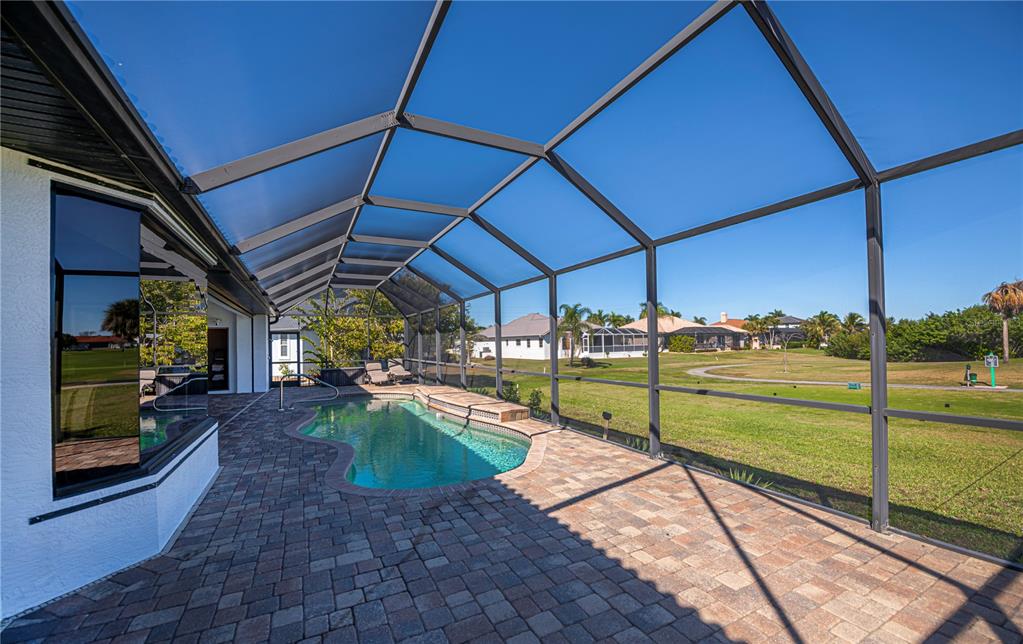 1736 Suzi Street Punta Gorda, FL 33950 - Photo 61 of 80 a view of a backyard with swimming pool