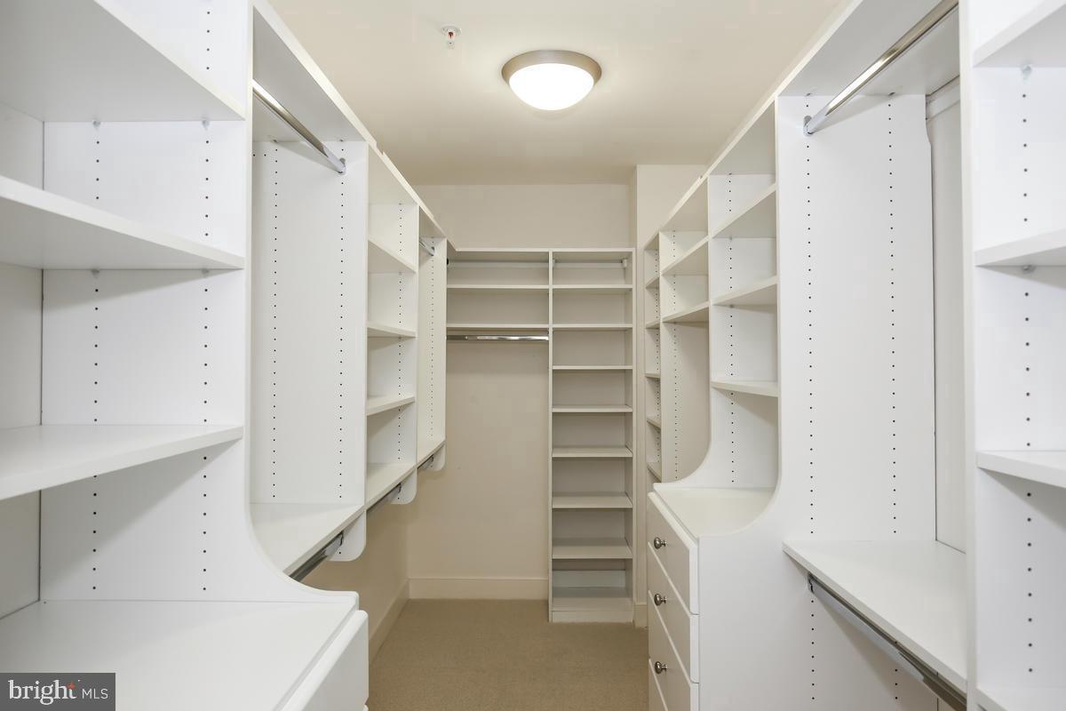 4301 Military Road Northwest, Unit 312 Washington, DC 20015 - Photo 8 of 9 a view of walk in closet with empty racks