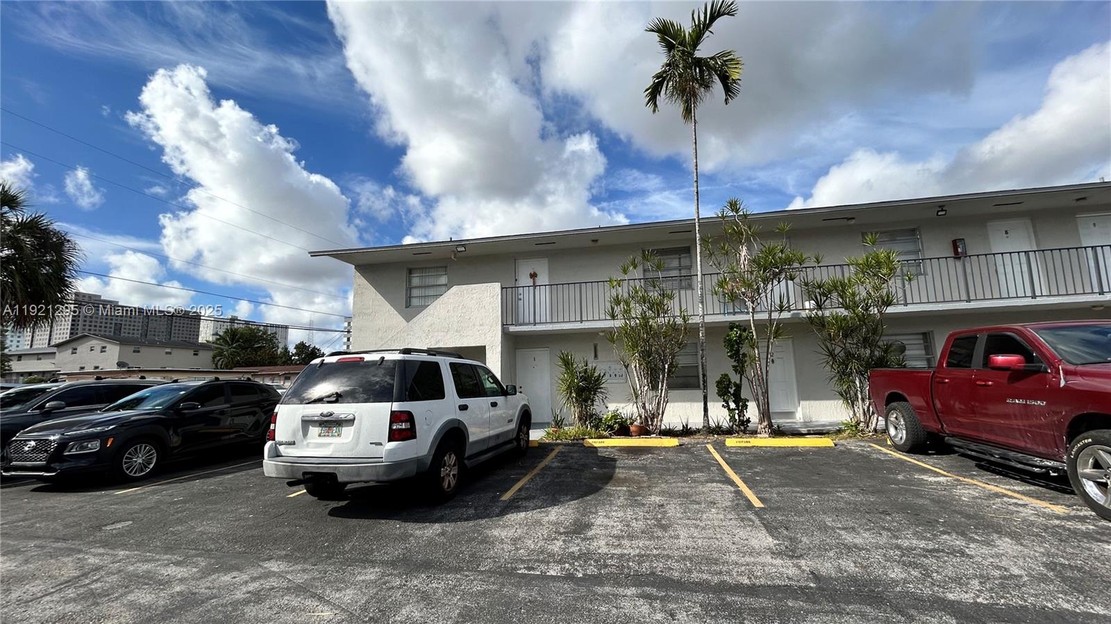10745 Southwest 3rd Street, Unit 6 Sweetwater, FL 33174 - Photo 4 of 5 a view of a car parked in front of a building