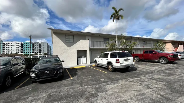 a front view of a house with parking space