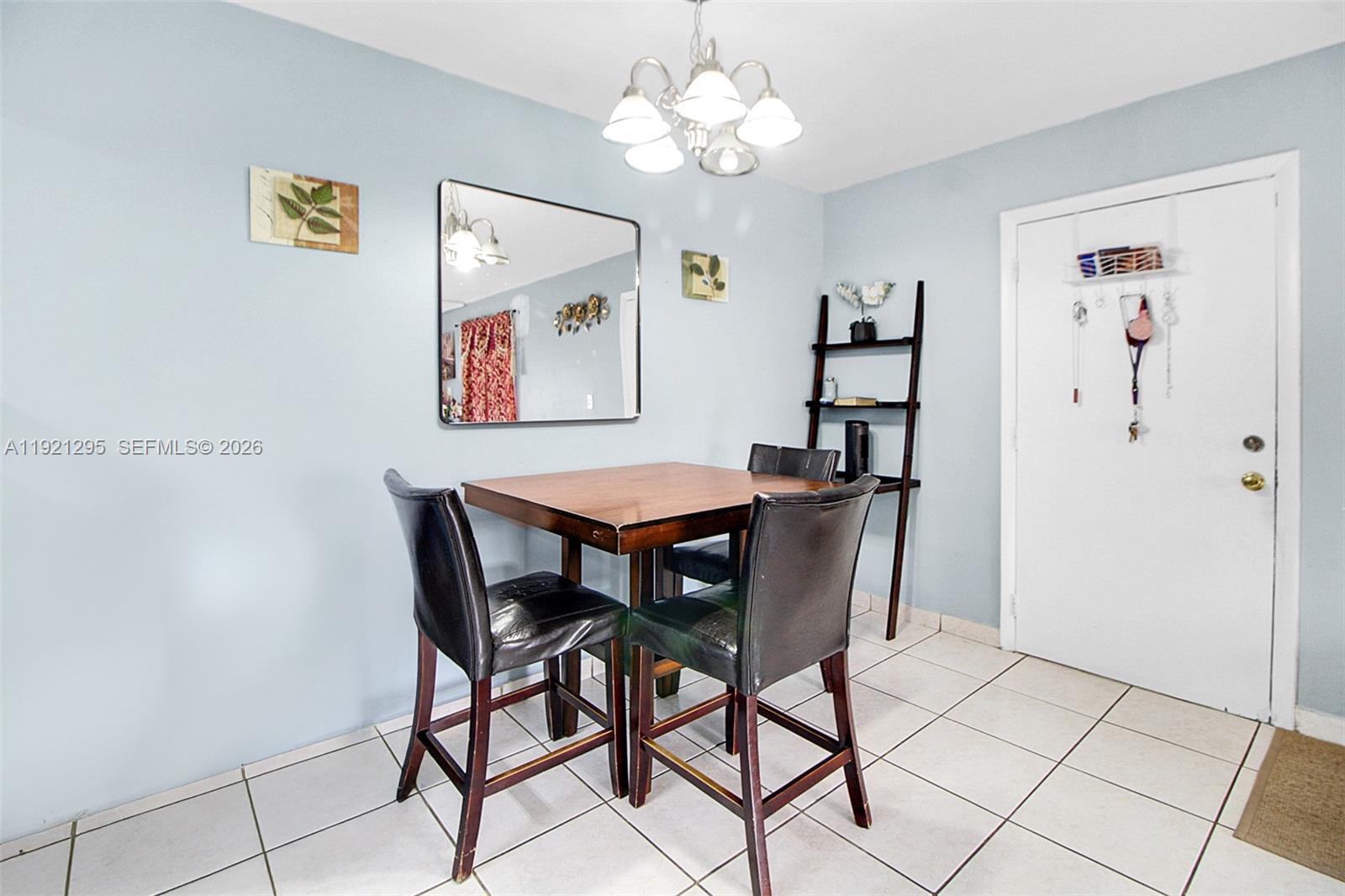 10745 Southwest 3rd Street, Unit 6 Sweetwater, FL 33174 - Photo 10 of 17 a view of a dining room with furniture
