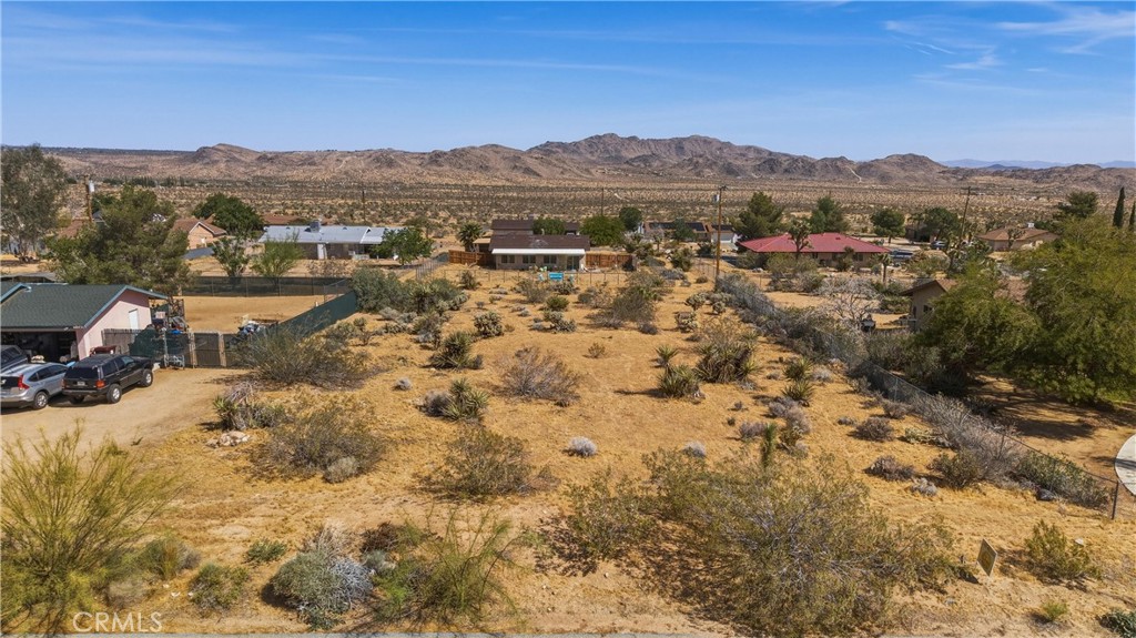 0 Adobe Joshua Tree, CA 92252 - Photo 12 of 13 a view of a lake with mountains in the background