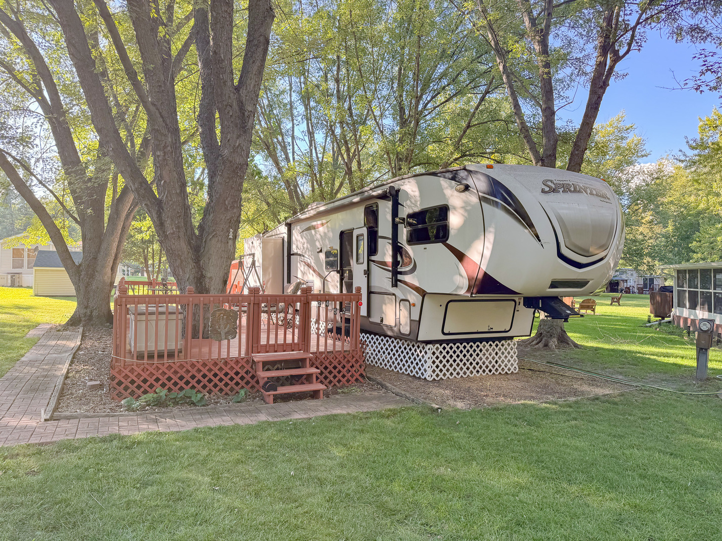 24-52 Woodhaven Sublette, IL 61367 - Photo 1 of 22 a front view of a house with a yard garden and glass space